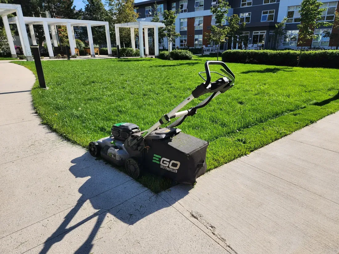 Battery-powered mower on a strata lawn edge
